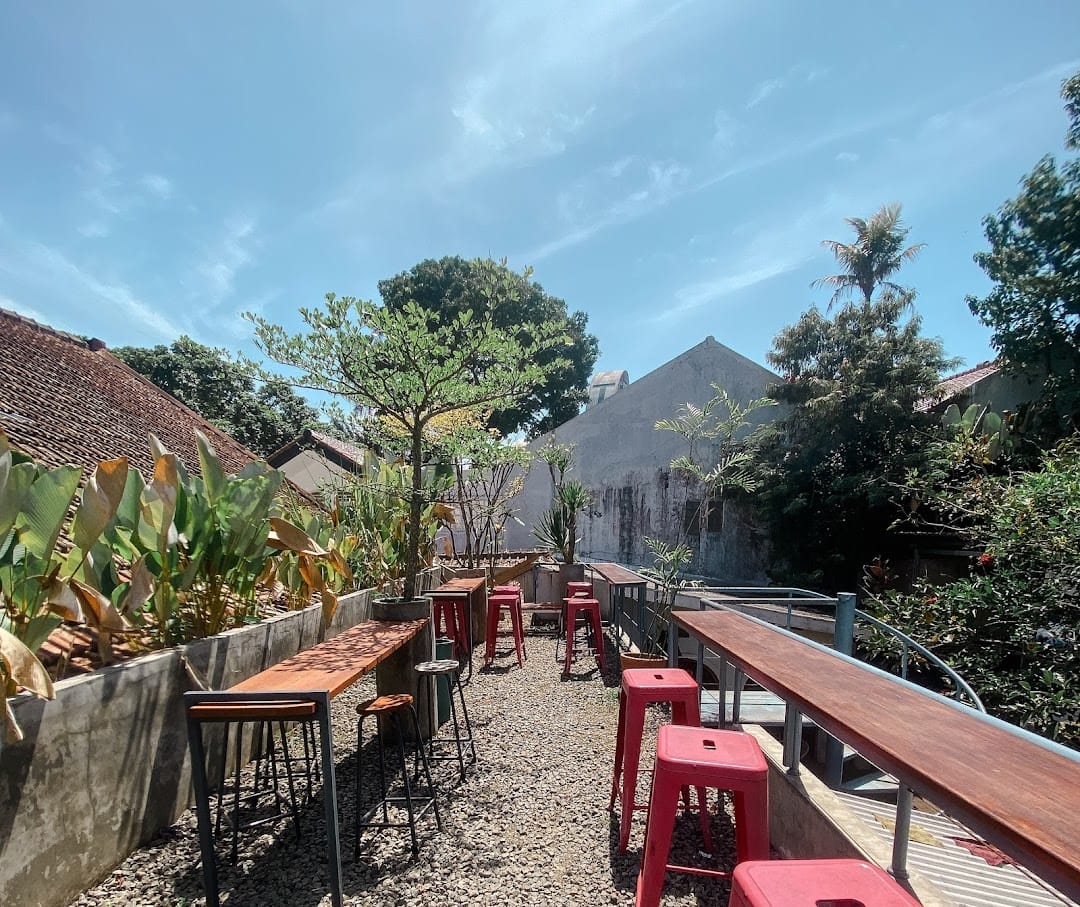 Courtyard with red metal stools